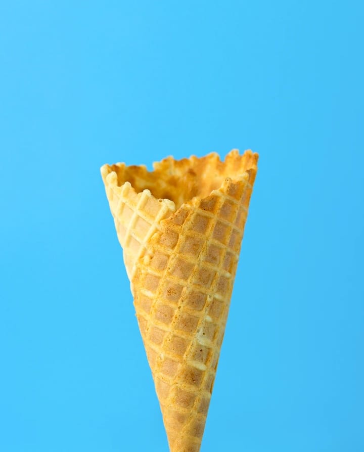 Icecream cone on bright blue background