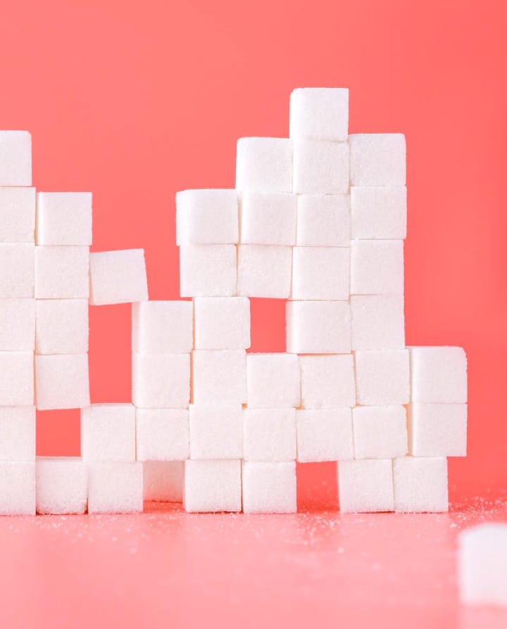 Sugarcubes stacked in pink environment